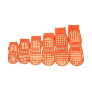 A set of pink trampoline socks in various sizes, displayed in a row on a white background.