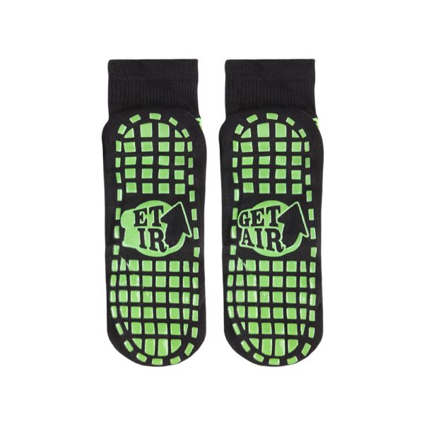 A pair of black and green Non Slip Trampoline Socks with the text "get air".