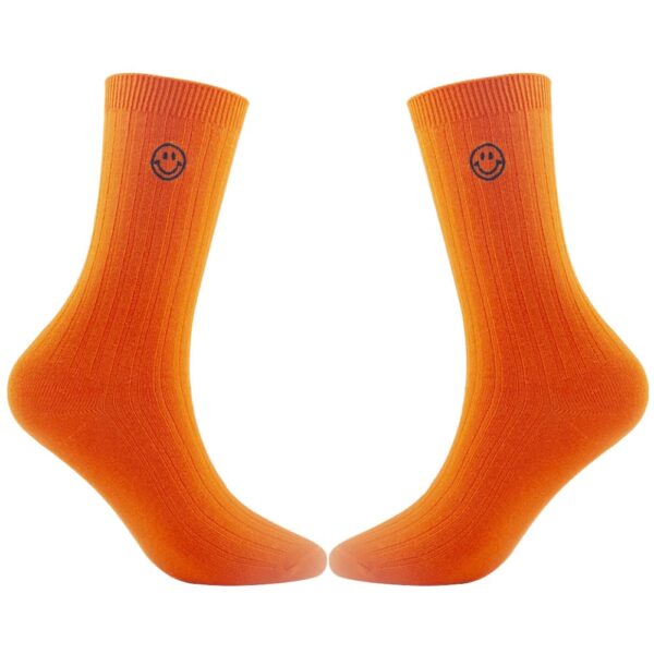 A pair of Custom Embroidered Dress Socks - Personalized Crew Socks with Knitted Design with a smiley face on each cuff.