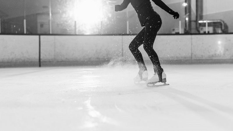 A woman is doing skating moves