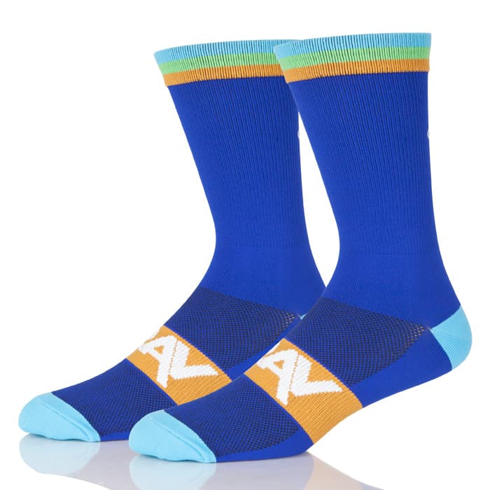 Blue athletic socks with light blue toes/heels, yellow-green trim, and white lettering on top. Offering comfort and protection.