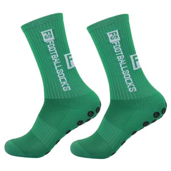 Tất đá bóng màu xanh lá cây có đế chống trượt màu đen, có dòng chữ "F3 FOOTBALLSOCKS AUTO-DRAFT" màu trắng ở hai bên.