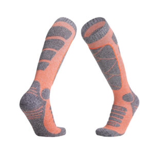 Two knee-high pairs of vibrant orange and gray "Best Thermal Socks" for extreme cold weather, ideal for winter skiing.