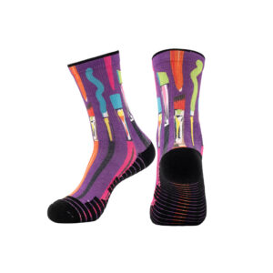 Custom Sinoknit socks in purple, black, multicolored with abstract paintbrush design; one sock upright, one laid flat.