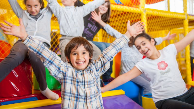 Kids enjoy thrilling adventures at one of the US's top indoor playgrounds, featuring colorful zones and exciting slides.