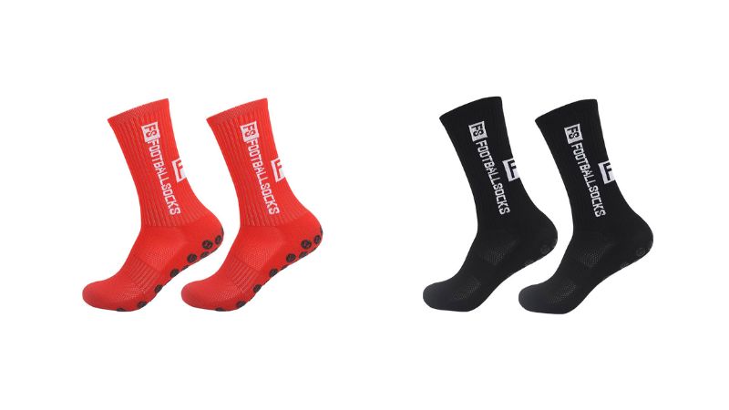 Two pairs of football socks, red and black, with non-slip grips and branding. Moisture-wicking to keep feet dry in intense matches.