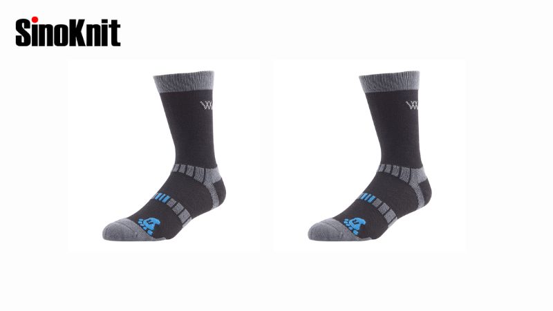 Two black and gray Merino wool socks with blue accents on a white background. SinoKnit logo top left. Ideal for summer comfort.