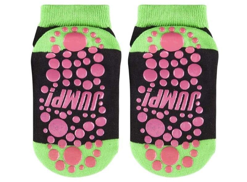 Black and green grip socks with pink dots and "JUMP!" on soles—great for unique sock fans or DIY inspiration.